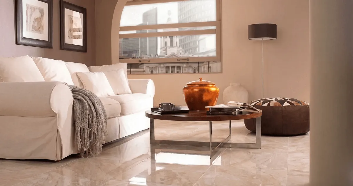 Modern living room with professionally installed marble flooring, a beige sofa, coffee table in Fargo, ND